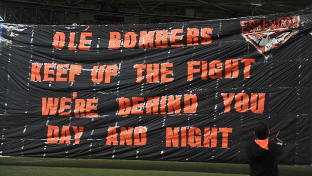 Sorry sign: Essendon's banner against North Melbourne on Saturday.