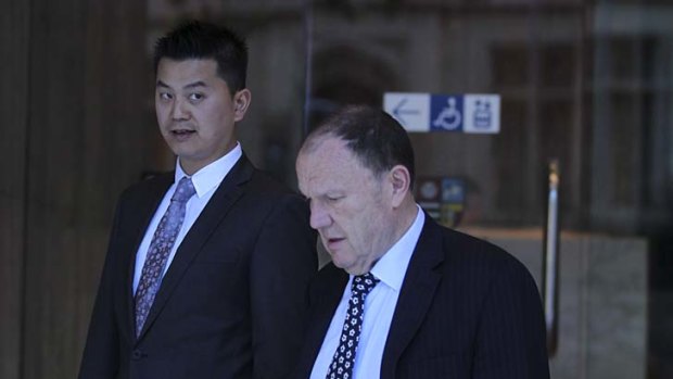 Senior Constable Hoan Thien Pham (left) with his lawyer.