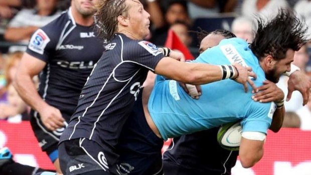 Jacques Potgieter charges into the Sharks defence.