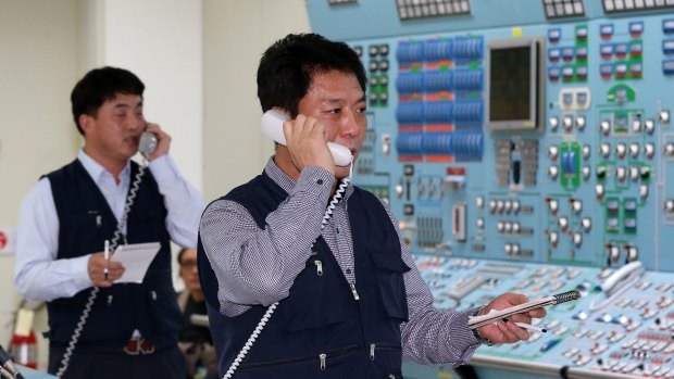 On alert ... South Korean employees conduct a simulated drill to ensure the safety of nuclear power plants under cyber attacks, at a training center of the Wolseong Nuclear Power Plant in the southeastern city of Gyeongju on Monday.