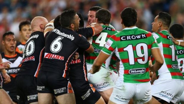 Sam Burgess and Aaron Woods get up close and personal.