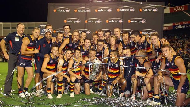 Quick off the mark: Adelaide players celebrate their 2012 NAB Cup victory.