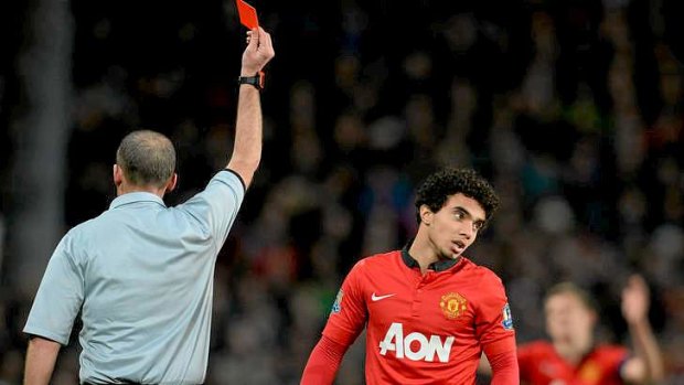 One man down: Manchester United's defender Fabio is sent off.