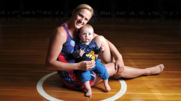 Retired former Australian netball captain Sharelle McMahon with her son Xavier. Netball Australia is more supportive of mums who want to bring their children on tour.