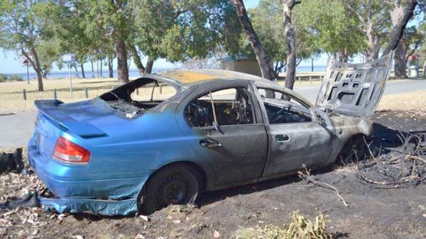 The car which slammed into a tree in Coodanup last night, bursting into flames.