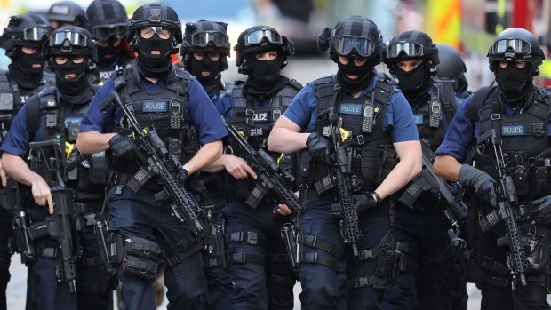 Counter-terrorism officers in London.  On Sunday morning the scene was still sealed off as police gathered evidence.