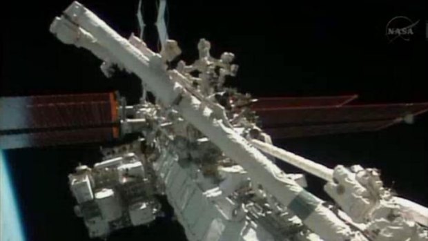 Flight engineers Michael Hopkins and Richard Mastracchio perform a series of spacewalks outside the International Space Station.