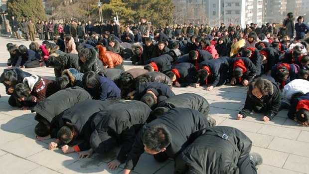 North Koreans cry after learning of the death of their leader Kim Jong-il.