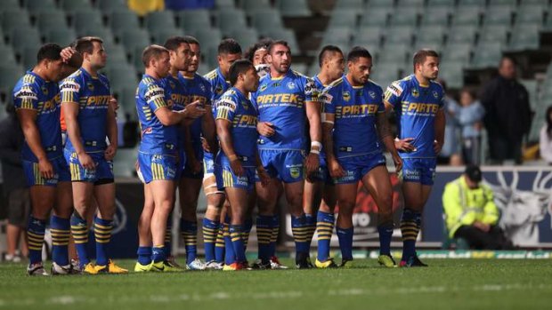 Familiar scene: Parramatta players look dejected after conceding a try in 2013.