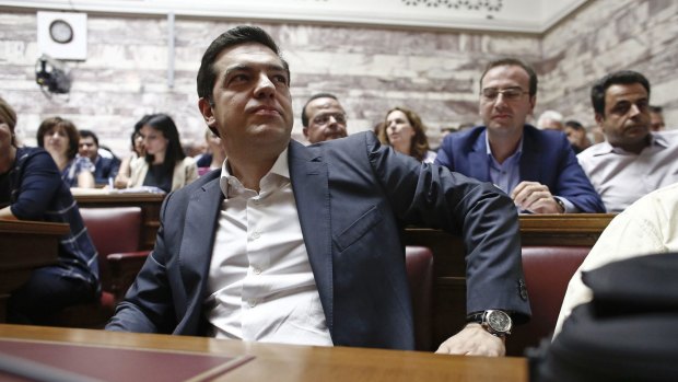 Hard sell ... Greek Prime Minister Alexis Tsipras pauses ahead of a parliamentary meeting of Syriza party MPs in Athens on Wednesday.