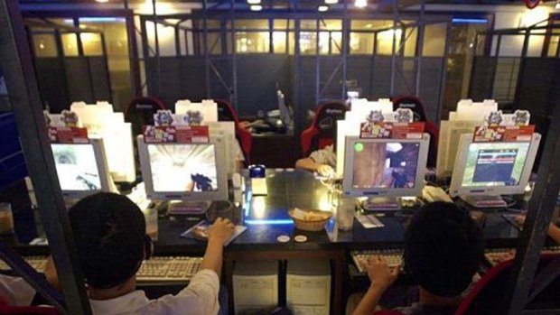 This file photo shows youngsters playing video games at an internet cafe in Taipei.