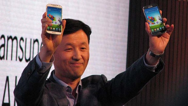 Yoon Seung-Ro, Australian managing director of Samsung, shows the Galaxy S4 to the crowd at the Opera House.