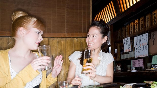 Drinking in an izakaya in Japan.
