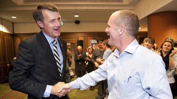 Lord Mayor Graham Quirk shakes hands with Premier Campbell Newman at the LNP's victory celebrations at the Sebel hotel in Brisbane.