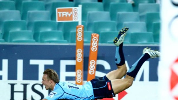 A rare highlight ... Tom Kingston scores a try for the Waratahs against the run of the play.