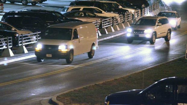 A white van, believed to be transporting Sergeant Robert Bales, leaves Kansas City International Airport on Friday.