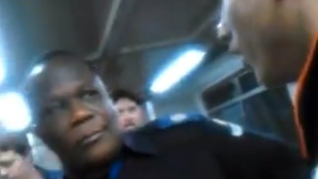 A screenshot from the video of a racist rant against a Queensland rail guard, pictured.