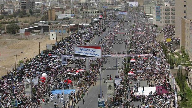 Anti-government protesters attend a ceremony in Sanaa commemorating the anniversary of Yemen's reunification.