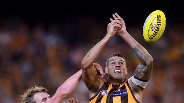 Buddy Franklin reaches for a mark at the MCG last night.