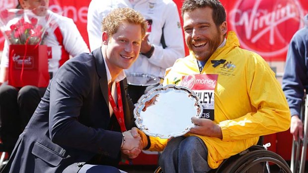All smiles: Prince Harry poses with Kurt Fearnley after the race.