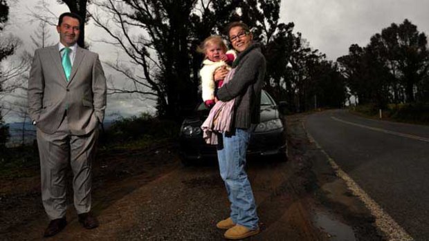 Anthony Rolando with wife Julia and daughter Phoebe on the Kinglake-Heaelsville Road.