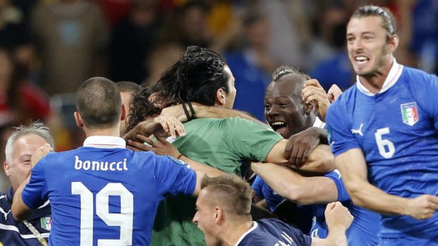 Italy's players celebrate  after winning the penalty shootout of the Euro 2012 soccer championship quarter-final match against England.