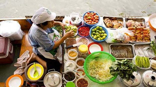 Live to eat ... a floating market vendor in Bangkok.