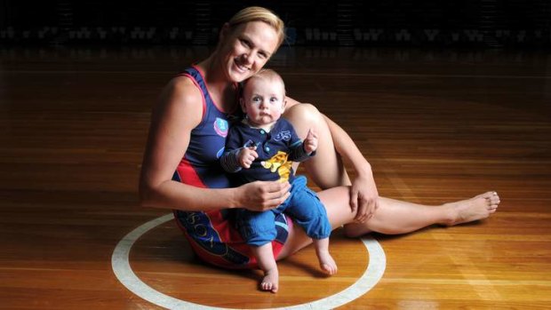 Front and centre: Melbourne Vixens shooter Sharelle McMahon with seven-month-old Xavier.