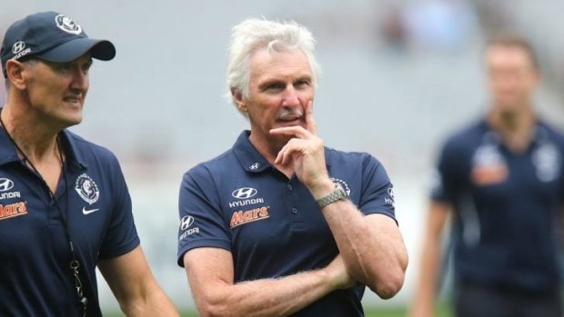 Mick Malthouse ponders his next move during Carlton's loss to Melbourne.