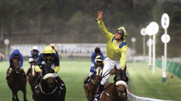 Damien Oliver's famous salute to his late brother, Jason, after Media Puzzle's victory in the 2002 Melbourne Cup.