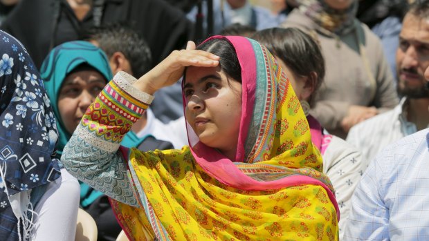 Nobel Peace Prize laureate Malala Yousafzai shades her eyes against the sun at a school for Syrian refugee girls, built by the NGO Kayany Foundation, in Lebanon's Bekaa Valley on July 12, 2015.
