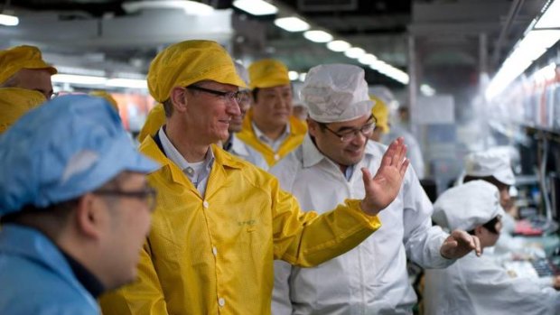 Apple chief Tim Cook visits the iPhone production line at the Foxconn Zhengzhou Technology Park, Henan.