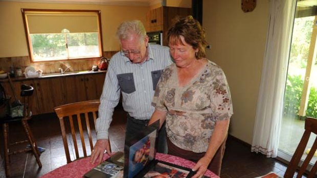 Grieving grandparents ... David and Sandra Auchterlonie with photographs of David's younger days.