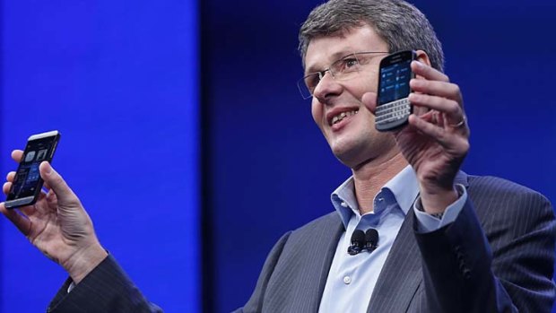 Revealed ... BlackBerry CEO Thorsten Heins shows off the Z10, left and Q10.