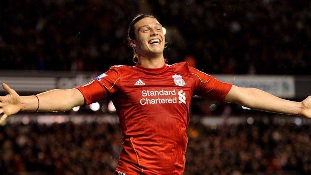 Andy Carroll of Liverpool celebrates scoring his team's third goal.