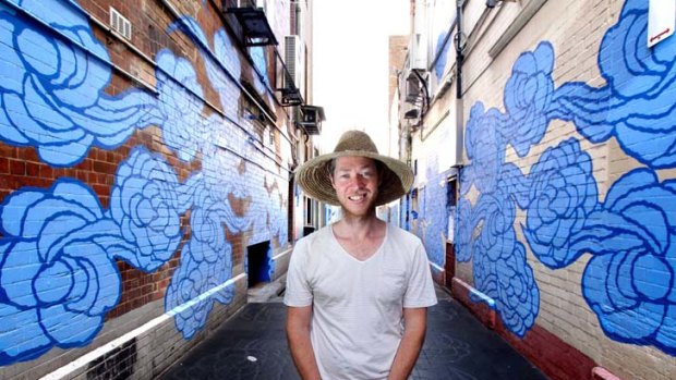 Job done ... Jason Wing has painted murals, etched designs into the paving and suspended metallic "spirit figures" in Kimber Lane.