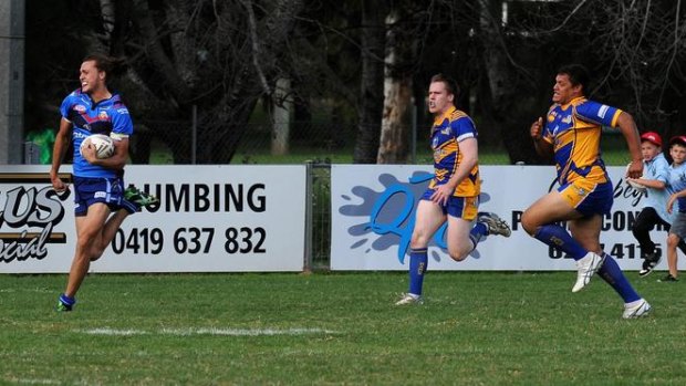 West Belconnen's Brad Smith runs the length of the field to score against the Woden Valley Rams yesterday.