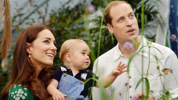 Catherine, Duchess of Cambridge holds Prince George as he and Prince William, Duke of Cambridge's look on while visiting the Sensational Butterflies exhibition at the Natural History Museum on July 2, 2014 in London.