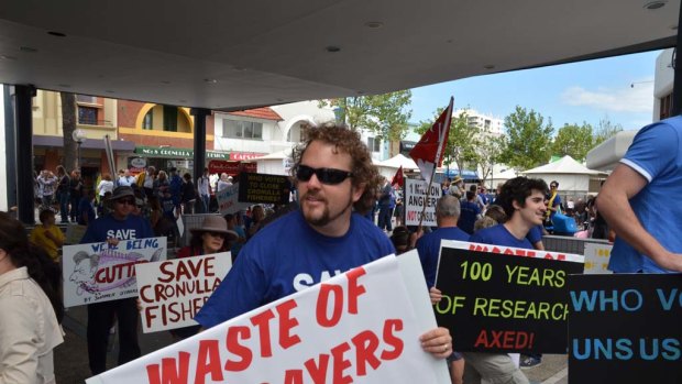 Workers at Cronulla Fisheries Research Centre and their supporters protest in the main shopping mall of Cronulla.