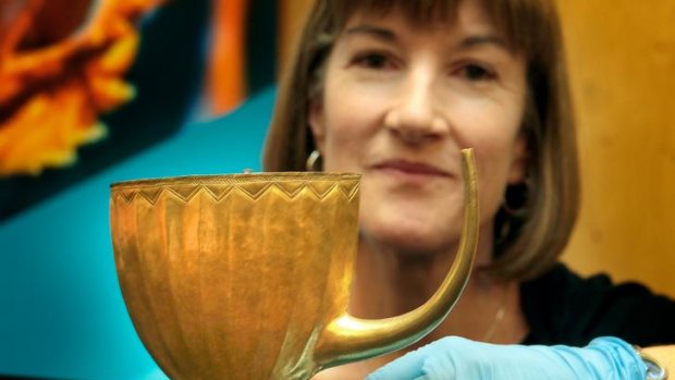 British Museum curator Sarah Collins with a 4500-year-old gold cup found in Ur (modern-day Iraq).
