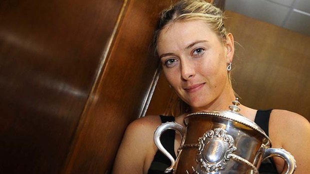 Sharapova with the Coupe Suzanne Lenglen in her changing room.