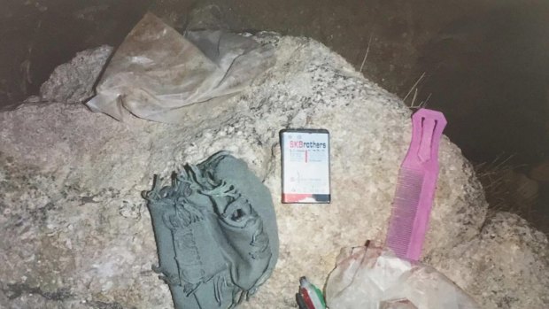 Photographs from the scene of a shooting, obtained by the ABC, show the contents of the pockets of an Afghan boy named as Khan Mohhamed from an ABC News report. Supplied