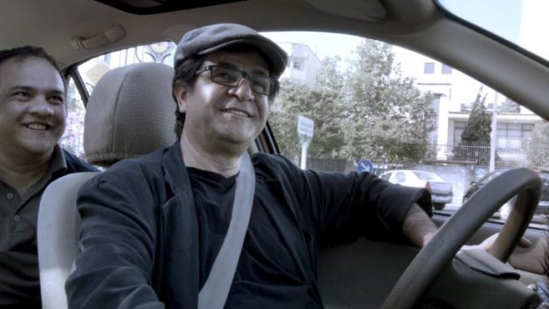 Banned ... director-star Jafar Panahi in <i>Tehran Taxi</i>.