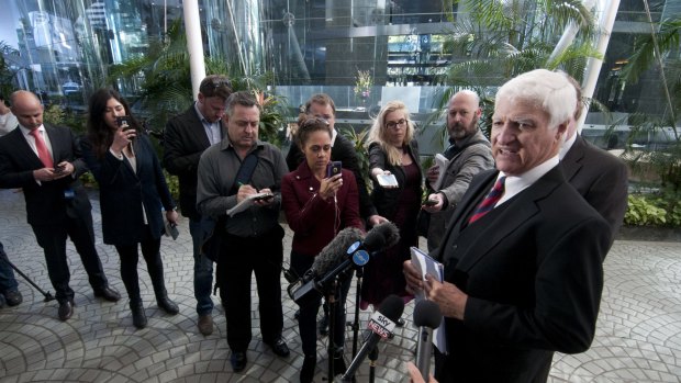 Assembled journalists hang on every word - and there were many - from MP Bob Katter as he declared his support for the PM.