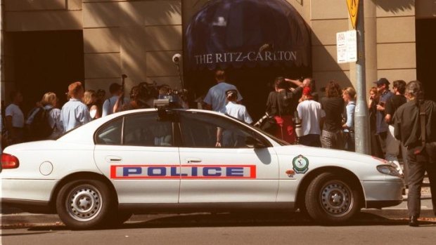 Hot spot: Police enter the Ritz-Carlton Hotel in Double Day after Michael Hutchence was found dead in one of the hotel's rooms on November 22, 1997.