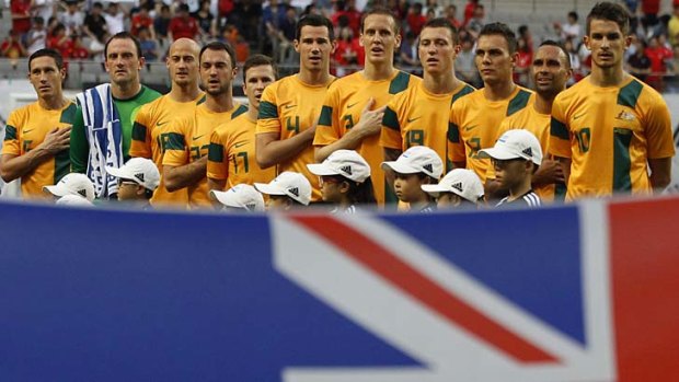The Socceroos sing their national anthem before their East Asian Cup match against South Korea.