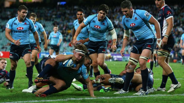 Michael Hooper scores for the Waratahs on Friday night. When he lines up against his old club in Canberra next Saturday, David Pocock and George Smith will be waiting.