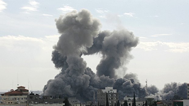 Smoke billows above the Gaza Strip following the Israeli air strikes.