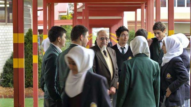 Australian International Academy head Salah Salman (centre) at the North Coburg school.