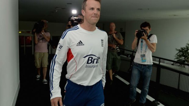 Graeme Swann of England arrives at a press conference to announce his retirement.